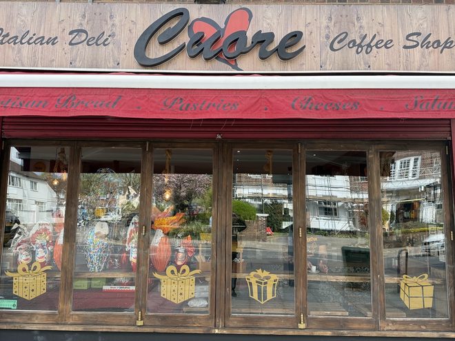 The shopfront window under the red awning
