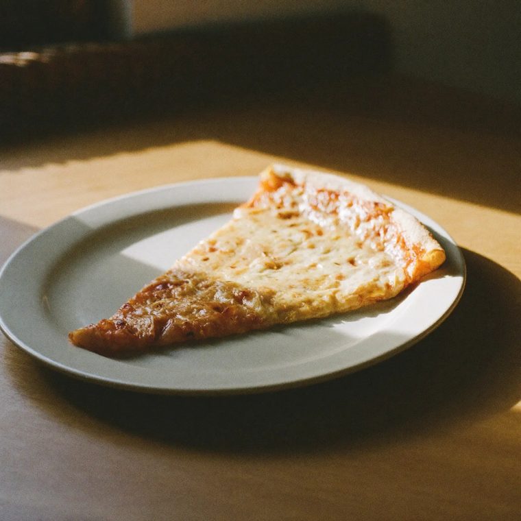 A slice of Italian pizza on a plate